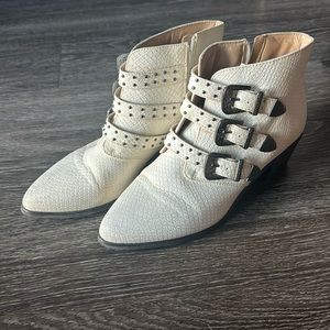 White tri-buckle booties